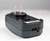 Photo 5 — Original universal wall charger with attachments for different countries, The black